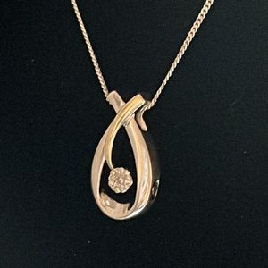 10k Gold Diamond swirl Flower pendant.